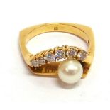 A CUTLURED PEARL AND DIAMOND CONTINENTAL DRESS RING  the 6mm diameter pearl with a line of six