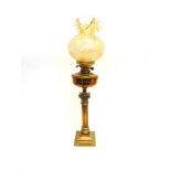 A BRASS CORINTHIAN COLUMN OIL LAMP with funnel and shade