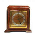 AN ELLIOTT MANTEL CLOCK the gilded square dial with a silvered chapter ring and Roman numerals,