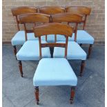 A SET OF SIX VICTORIAN MAHOGANY DINING CHAIRS the shaped backs with carved rails, with upholstered