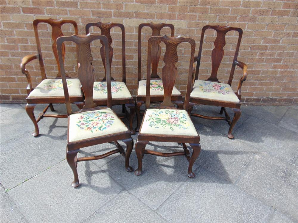 A SET OF SIX OAK DINING CHAIRS including matching pair of carvers, with shaped splats, needlework