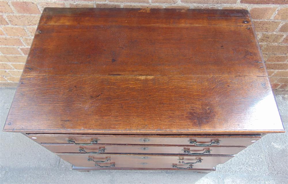 A SMALL OAK CHEST fitted with four long graduated drawers, 76.5cm wide 47cm deep 80.5cm high - Image 2 of 3