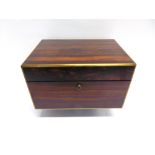 A VICTORIAN BRASS MOUNTED COROMANDEL BOX, cedar lined, with flush fitting brass carrying handles and