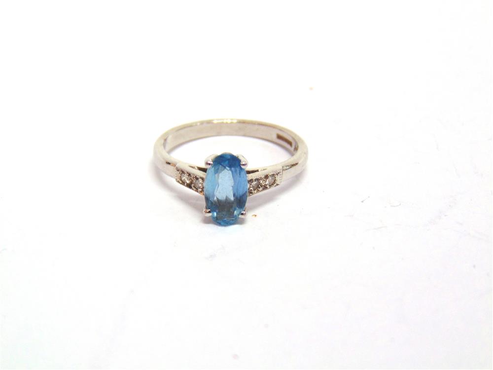 AN AQUAMARINE AND DIAMOND 18 CARAT WHITE GOLD RING the long oval cut measuring approximately 8.6