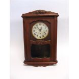 AN OAK CASED WALL CLOCK with 8-day Westminster chime movement