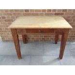 A PINE KITCHEN TABLE ON SQUARE TAPERING SUPPORTS 105cm long 66cm deep 76cm high