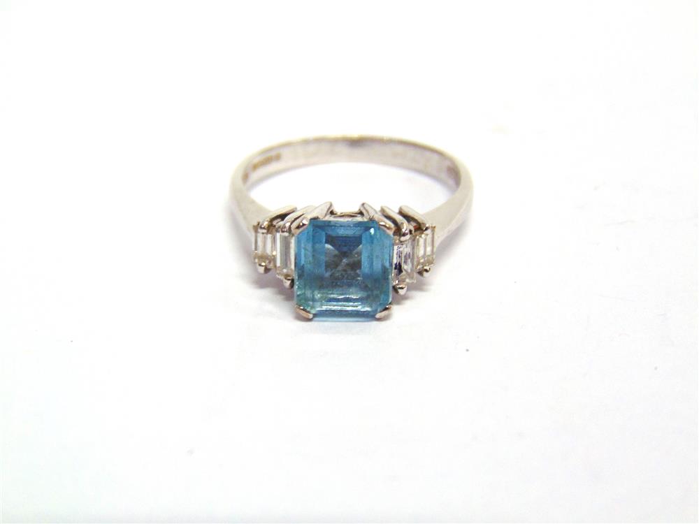 AN AQUAMARINE AND DIAMOND 18CT WHITE GOLD RING the square cut stone, 6.8 by 6.7 by 3.9mm deep,
