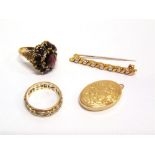 A 9CT GOLD GARNET CLUSTER RING finger size O, a 9ct gold oval locket; a 9ct gold seven stone