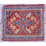 A SMALL RUG OR BAG FACE with central foliate motif within a decorative border 73cm x 63cm; and a red