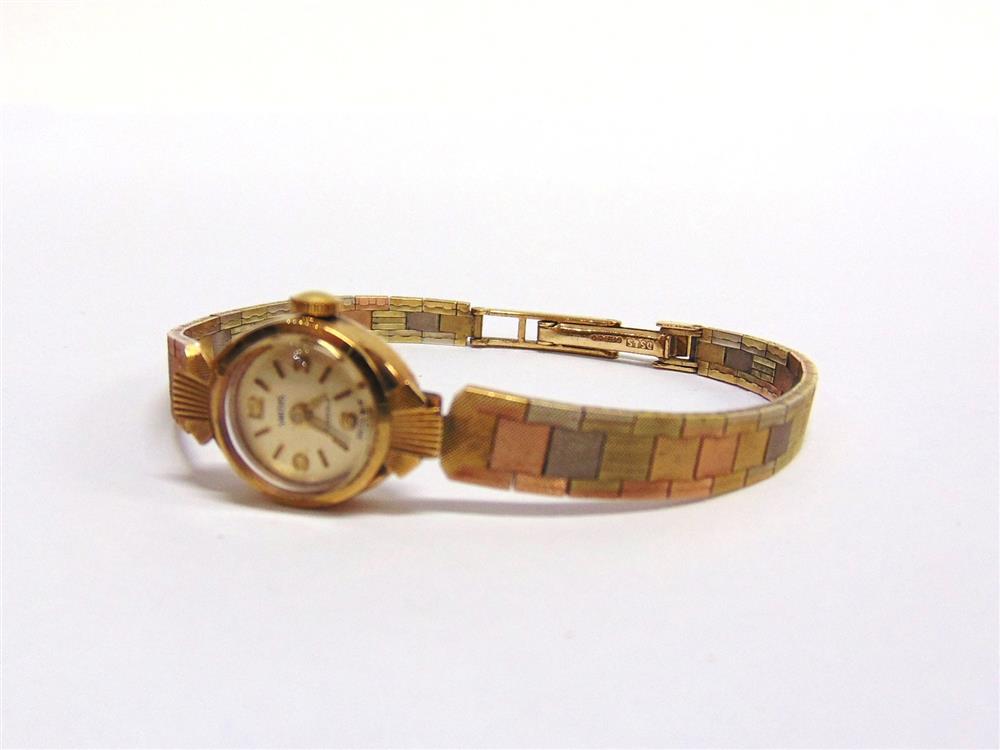 SMITHS, A LADY'S 9CT THREE COLOUR GOLD MECHANICAL BRACELET WATCH 17.5g excluding movement,