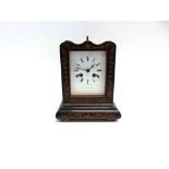 A 19TH CENTURY FRENCH MANTLE CLOCK the ebonised case with foliate inlay, the white enamel dial