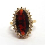 A GARNET AND WHITE STONE 9 CARAT GOLD CLUSTER RING finger size Q½, 5.7g gross