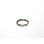 A DIAMOND FULL ETERNITY RING set with small brilliant, Swiss and single cut stones, shank is cut and