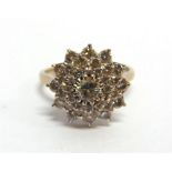 A THIRTY SEVEN STONE DIAMOND 18CT WHITE GOLD CLUSTER RING the central brilliant of approximately 0.3
