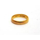 A 22 CARAT GOLD WEDDING RING of plain shallow D section, 4.4mm wide, finger size N, 5.8g gross