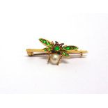 A GEM SET BUG BAR BROOCH circa 1900, demantoid garnet set wings and thorax, pearl abdomen,