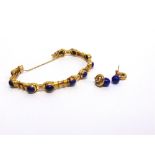 AN EGYPTIAN LAPIS LAZULI BRACELET and similar earrings, with control marks, the cabochon with