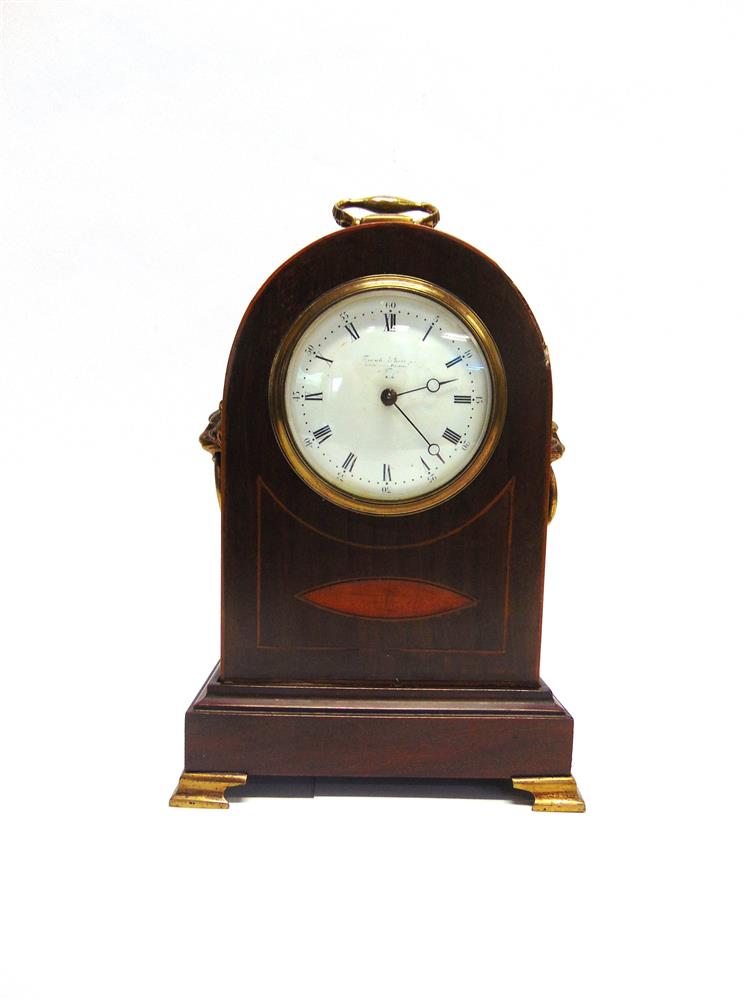 AN EDWARDIAN INLAID MAHOGANY MANTLE CLOCK  with lion mask brass handles to the sides, the enamel