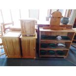 A STRIPPED PINE OPEN BOOKCASE  94cm wide 32.5cm deep 92cm high, pair of pine bedside cupboards, a