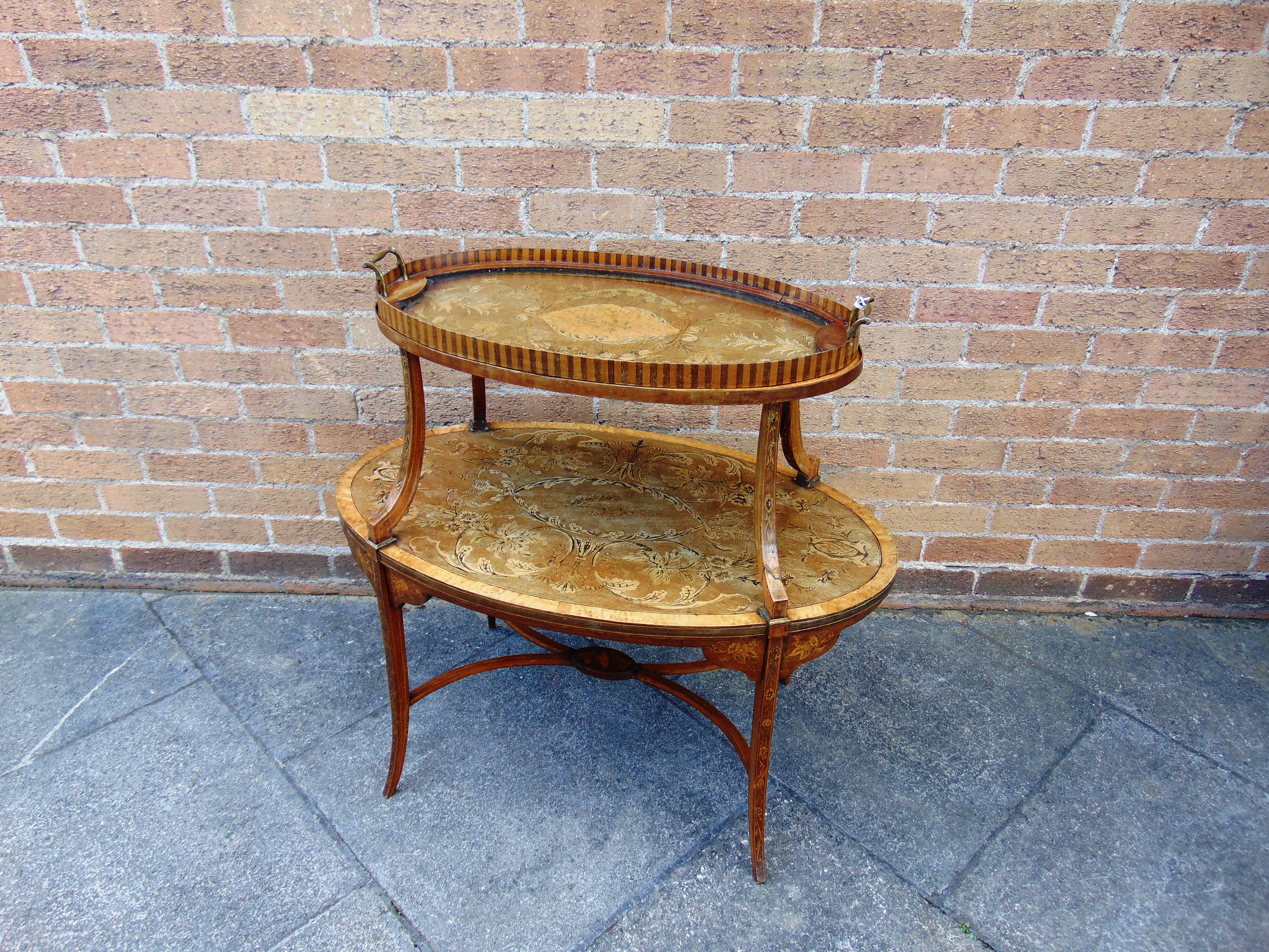 AN EDWARDIAN MAHOGANY GRADUATED TWO TIER ETAGERE,  with allover foliate marquetry and penwork