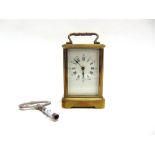 A SMALL BRASS CASED CARRIAGE CLOCK, the enamelled dial with Roman numerals and Arabic minute