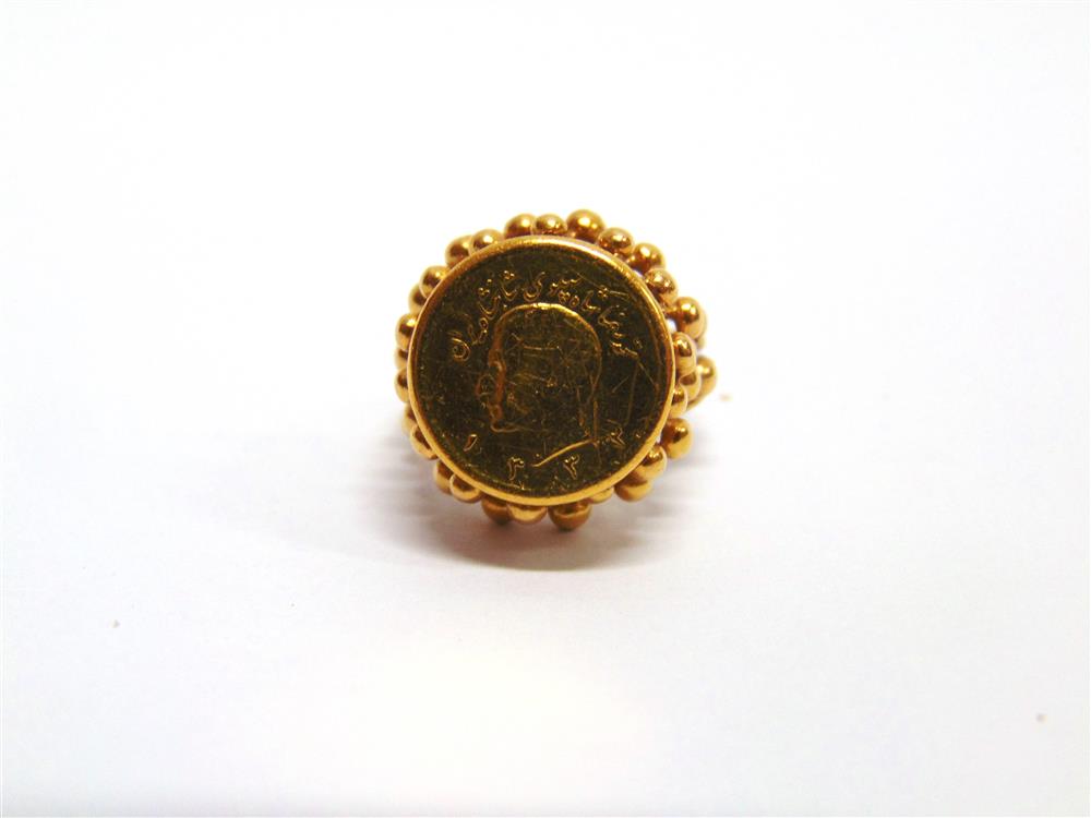 A PERSIAN GOLD COIN mounted as a ring, the mount unmarked, 7.9g gross