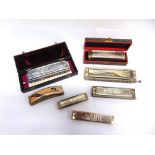 SEVEN ASSORTED HARMONICAS by Hohner (4) and others, two of them boxed.