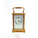 A FRENCH BRASS CASE CARRIAGE CLOCK, striking hour and half hour, the white enamelled dial with Roman