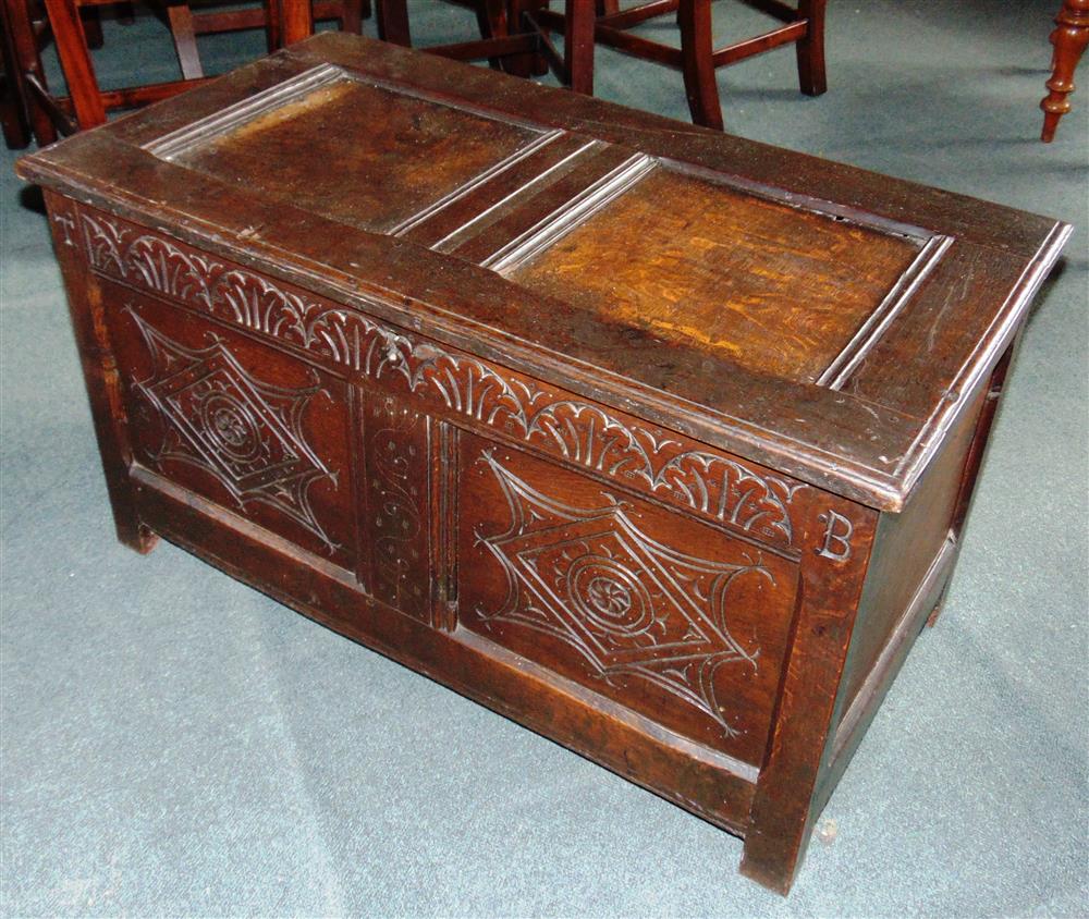 A SMALL OAK COFFER OF PANELLED CONSTRUCTION  with carved decoration, 91cm wide 48cm deep 52cm high - Image 2 of 2