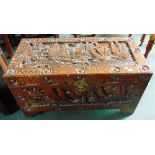 A CARVED CAMPHOR WOOD BOX  decorated with shipping scenes, 88.5cm wide 43cm deep 47cm high