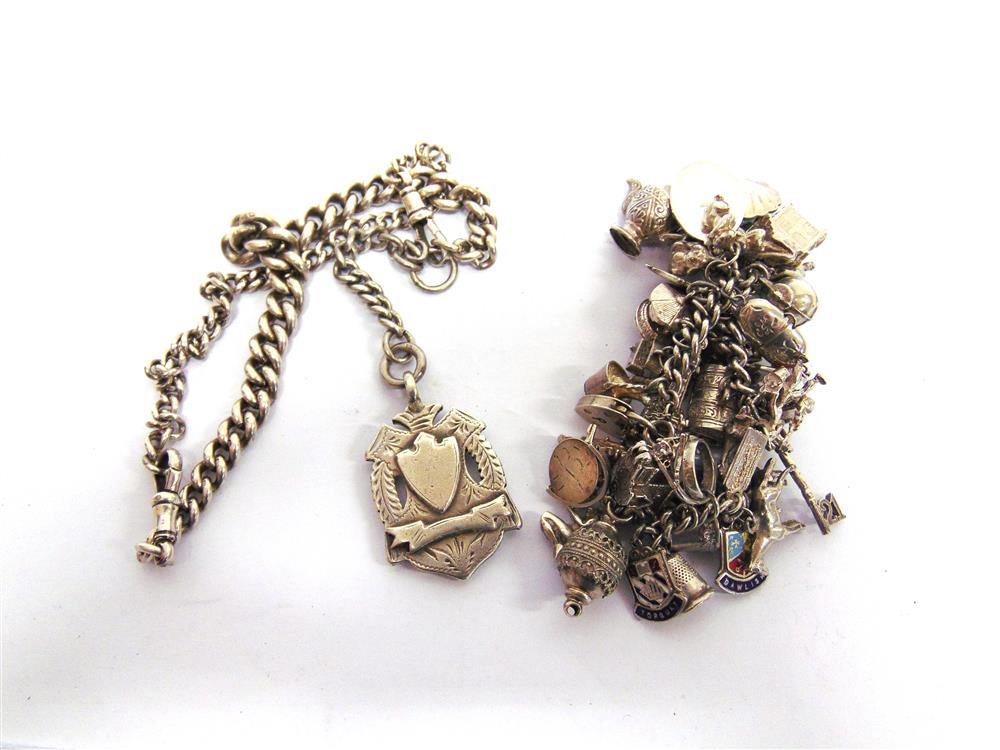 A SILVER BRACELET with charms attached; and a silver watch chain with a silver fob attached, 184g