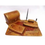 A LEATHER DESK ACCESSORY SET comprising stationery box, blotter, notepad holder, and pen stand.