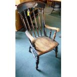 A COMB BACK WINDSOR ARMCHAIR on double H-shaped stretcher base, 112cm high overall, the seat 48.