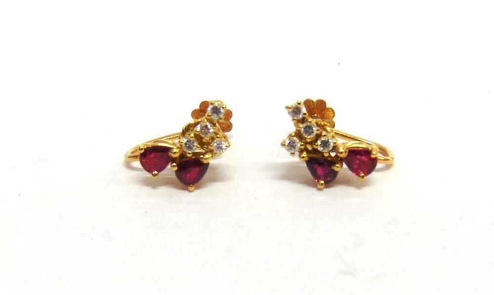 A PAIR OF RUBY AND DIAMOND EARRINGS each set with two pendeloque cut rubies with four diamonds