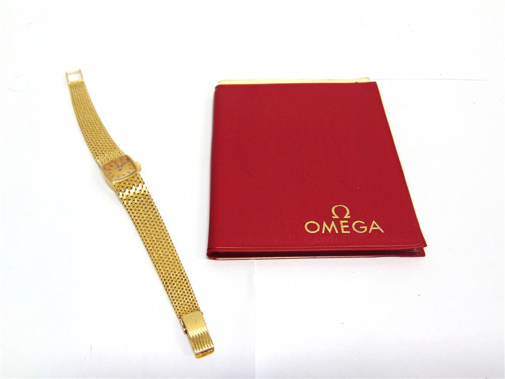 OMEGA a lady's 18 carat bracelet watch, the gilt cushion shaped dial with black hands and batons, - Image 2 of 2