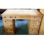 A PITCH PINE TWIN PEDESTAL DESK  121cm wide 64cm deep 75cm high