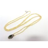 A TWO ROW CULTURED PEARL NECKLACE the 135 and 127 pearls of approximately 3.3-7.4mm, to a paste