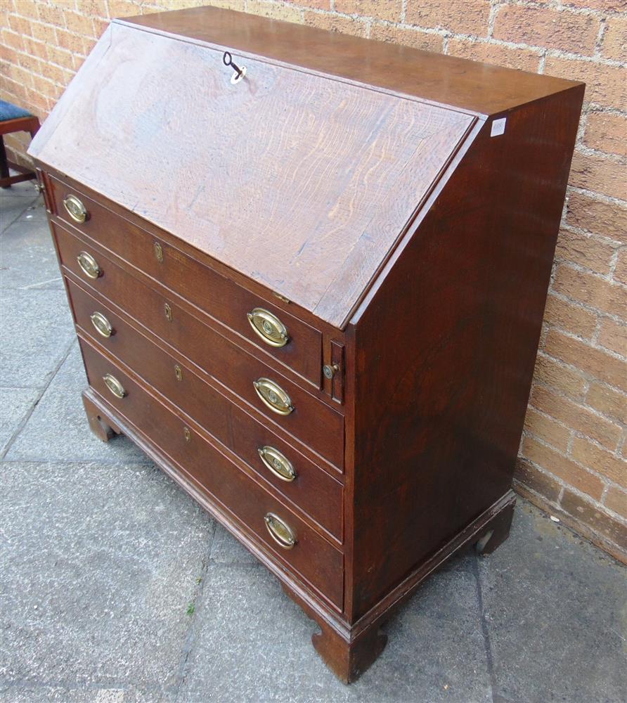 A GEORGE III OAK BUREAU  with fitted interior over four long drawers on bracket feet, 102cm wide - Image 4 of 4