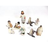 A GROUP OF RUSSIAN LOMONSOV FIGURES including young Inuit girl with a sturgeon, another similar
