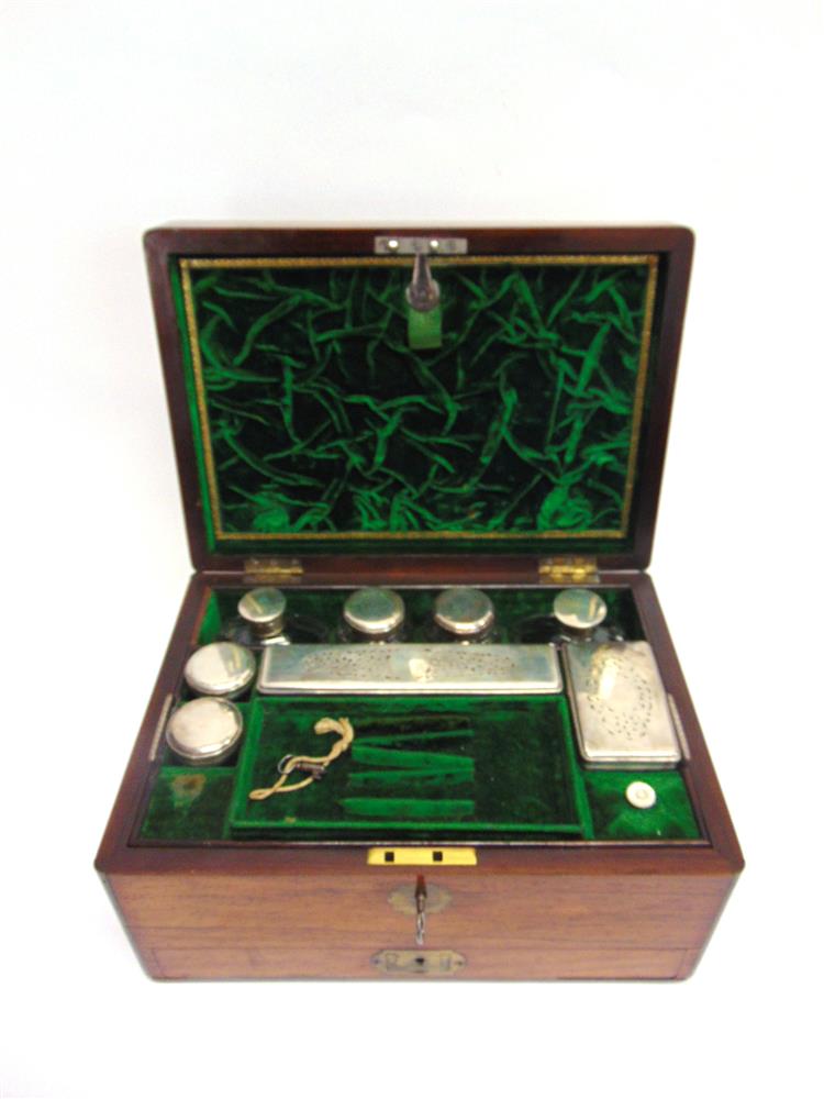 AN EARLY VICTORIAN BRASS MOUNTED ROSEWOOD VANITY BOX,  the fitted interior containing eight glass