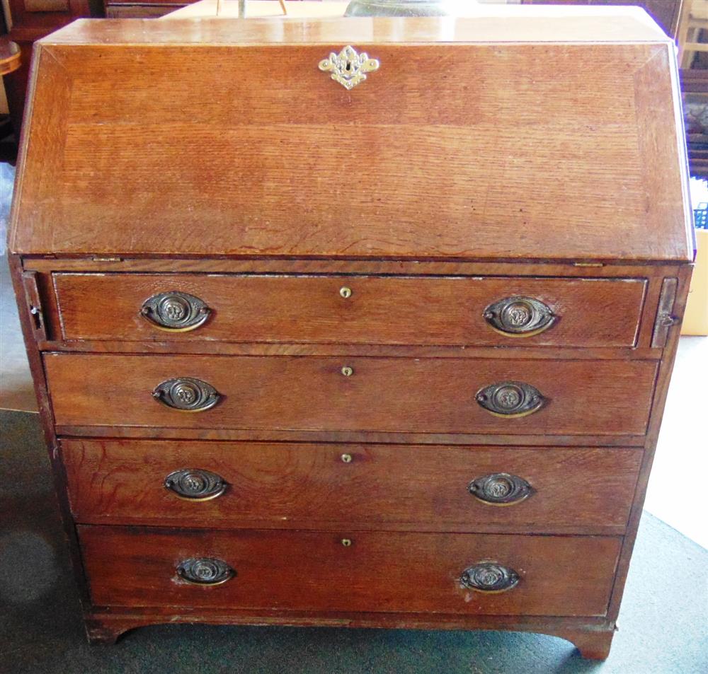 A GEORGE III PROVINCIAL OAK BUREAU,  with fitted interior over four long graduated drawers, 94cm