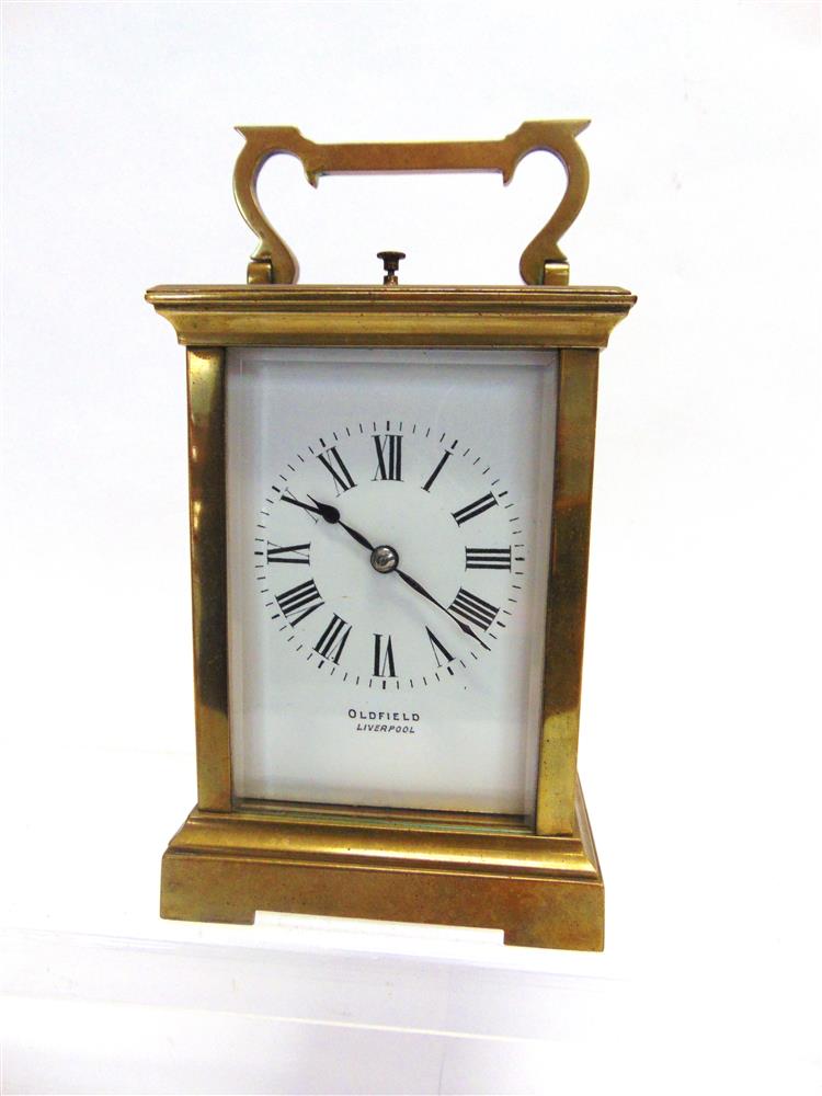 AN 8-DAY BRASS CASED CARRIAGE CLOCK  with repeat mechanism, the enamelled Roman numeral dial