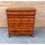 A 19TH CENTURY CONTINENTAL CHEST  of four long moulded drawers flanked by turned pilasters, 96cm