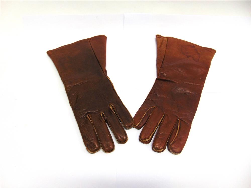 A MATCHED PAIR OF BRITISH BROWN LEATHER FLYING GLOVES size 8 1/2, one labelled 'Ref. No. 22C/991 ...