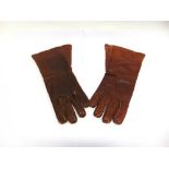 A MATCHED PAIR OF BRITISH BROWN LEATHER FLYING GLOVES size 8 1/2, one labelled 'Ref. No. 22C/991 ...