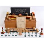 A FRENCH TABLE CROQUET SET late 19th or early 20th century, comprising eight turned wood mallets,