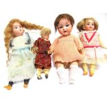 FOUR SMALL BISQUE SOCKET-HEAD DOLLS comprising a bisque socket-head doll, with a long crimped