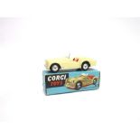 A CORGI NO.301, TRIUMPH T.R.2 SPORTS CAR cream, with smooth hubs, very good condition, boxed, the