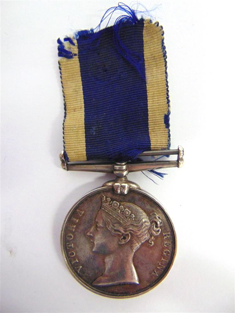 A ROYAL NAVAL LONG SERVICE AND GOOD CONDUCT MEDAL TO COMMISSIONED BOATMAN A. BEALE, H.M. COAST GUARD