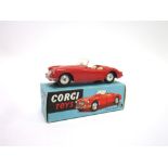 A CORGI NO.302, M.G.A. SPORTS CAR red, with smooth hubs, excellent condition, boxed, the box good.